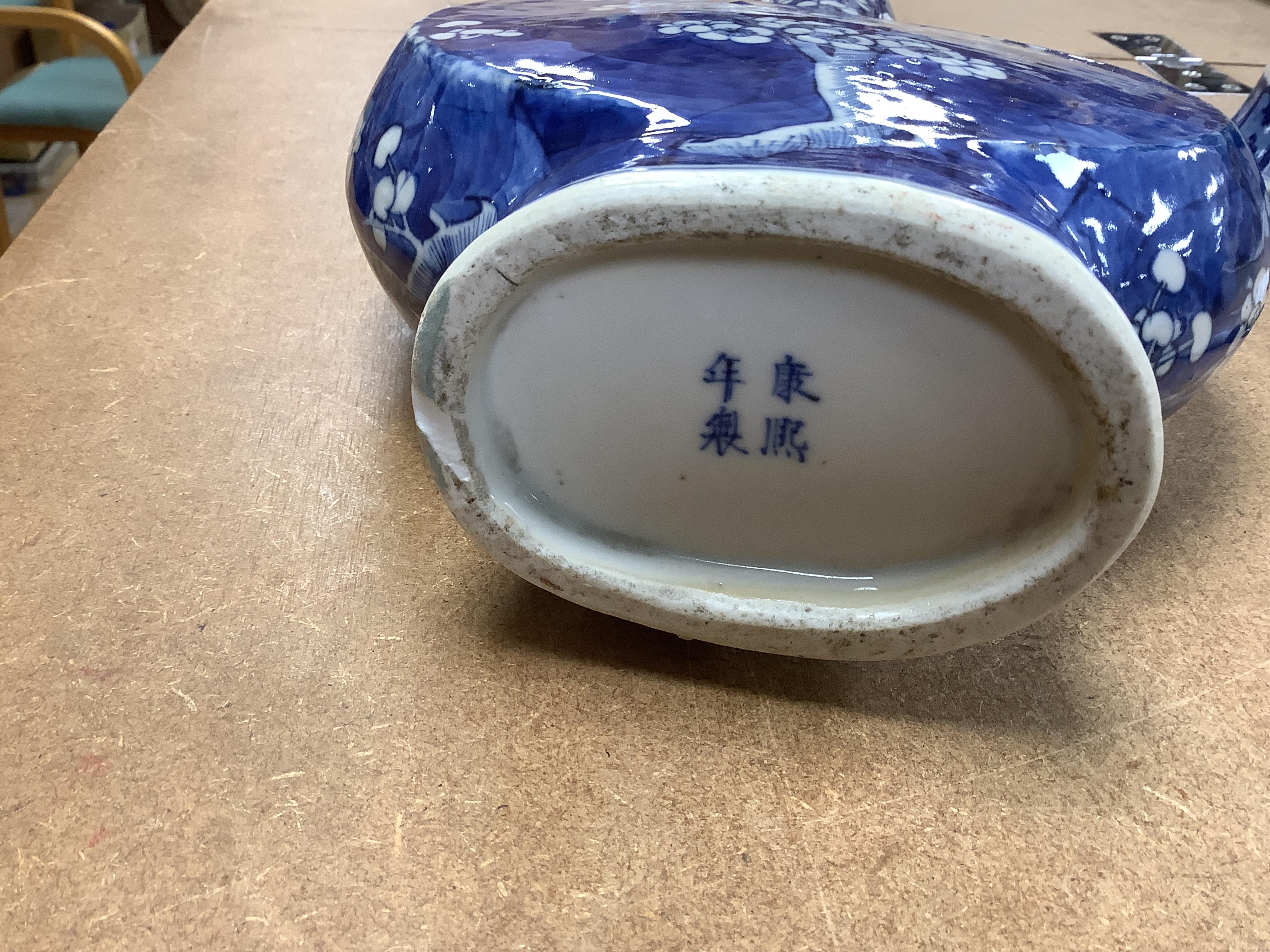 A Chinese blue and white prunus flower moon-flask and a Gu vase, largest 30cm high